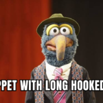 Muppet with long hooked beak